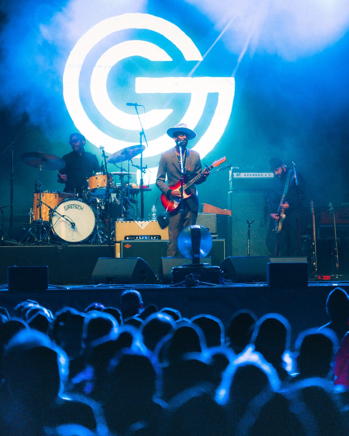 Gary Clark Jr performing on stage with guitar at outdoor festival in St. Augustine, Florida