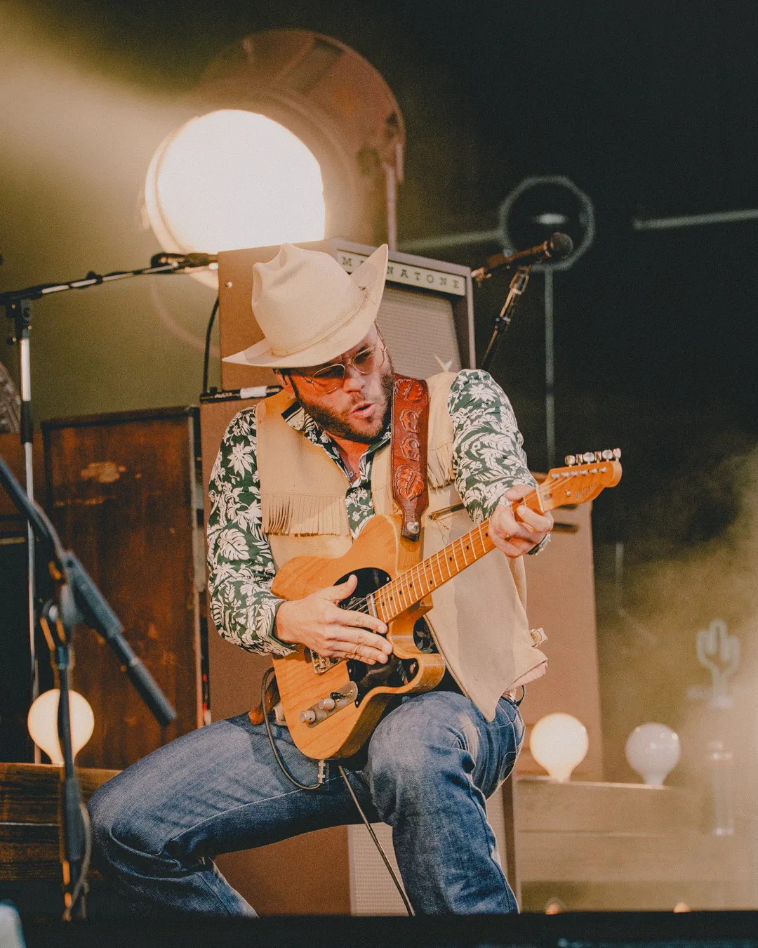 Charley Crockett guitar performance at St. Augustine Amphitheatre